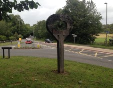 ...along with its holy signpost and fancy cars, top down and all.